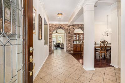 Elegant, spacious foyer leading to an inviting open-concept layout | Image 3