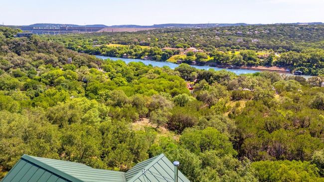 Aerial view of a large body of water and a heavily wooded area | Image 37