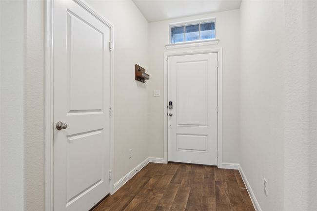 Doorway with dark wood-style floors and baseboards | Image 14