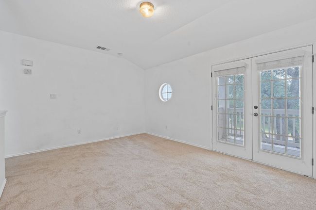 Empty room featuring carpet, vaulted ceiling, and baseboards | Image 15