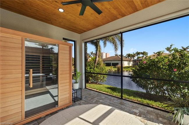 Unfurnished sunroom featuring a water view and wooden ceiling | Image 29