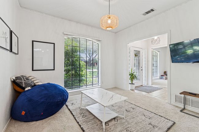 Misc room with carpet flooring and ornamental molding | Image 5