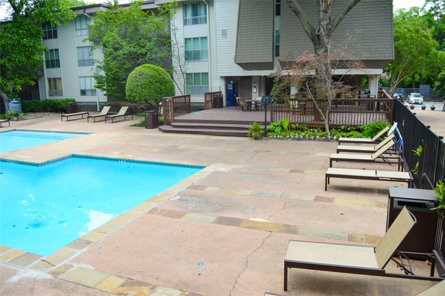 Community pool with a patio and a wooden deck | Image 28
