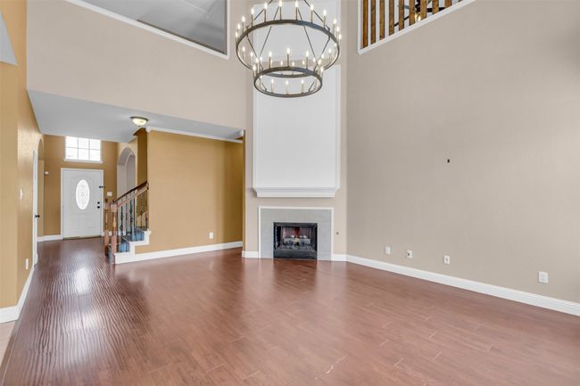 Living room featuring a fireplace. | Image 11