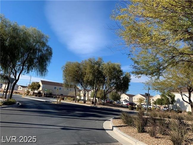 View of asphalt street featuring a residential view and curbs | Image 19