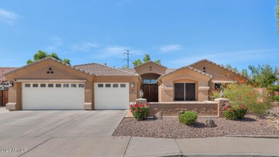 Welcome to this beautiful home in Chandler! Featuring 4 spacious bedrooms + Den, 2.5 baths, and a sparkling pool! | Image 1