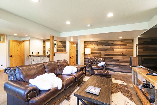 Basement Family Room Living area with wood walls and recessed lighting | Image 30