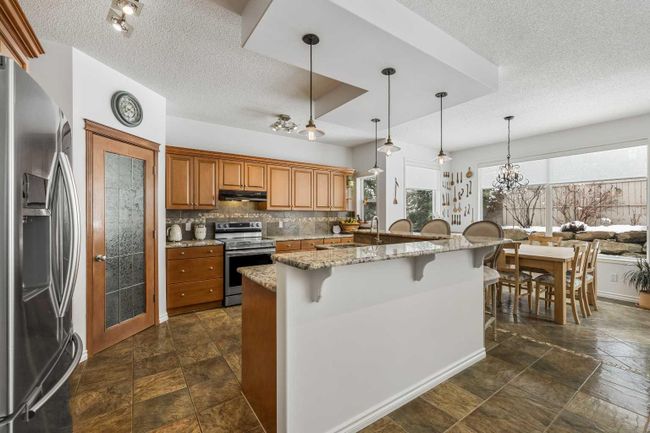 110 Tuscany Ridge Close Nw, Home with 4 bedrooms, 3 bathrooms and 2 parking in Calgary AB | Image 2