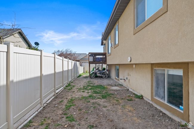 View of yard featuring fence | Image 38