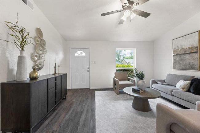 New flooring throughout the home, adding warmth and charm. | Image 6