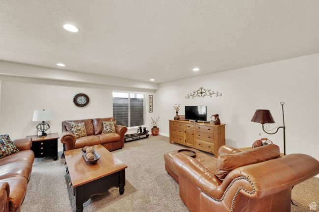 Carpeted living area with recessed lighting | Image 22