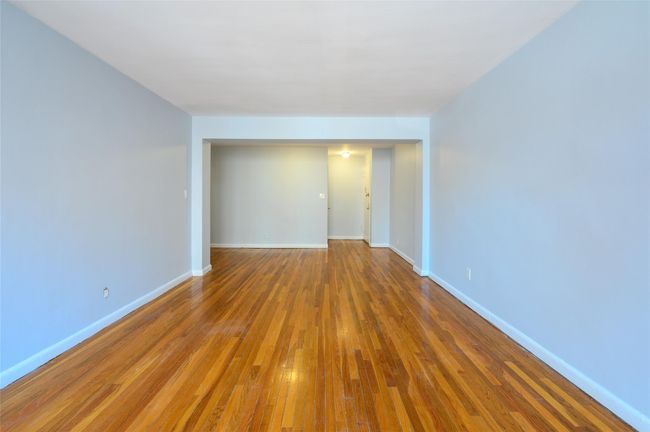 Empty room with wood-type flooring | Image 4