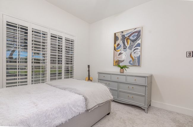 Bedroom with light carpet and baseboards | Image 24