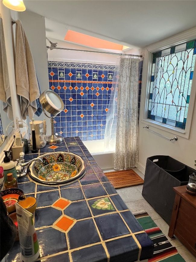 Primary bathroom with stained glass window | Image 17