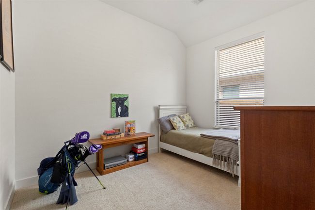 Bedroom featuring vaulted ceiling and carpet flooring | Image 12