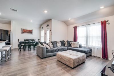 Living room featuring lofted ceiling and wood-type flooring | Image 3