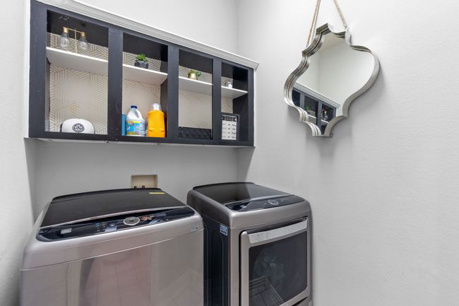 Laundry room with cabinets | Image 26