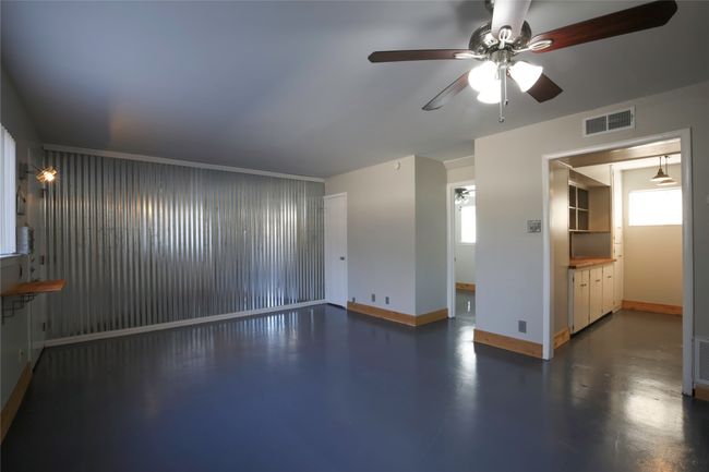 Unfurnished room featuring ceiling fan and baseboards | Image 12