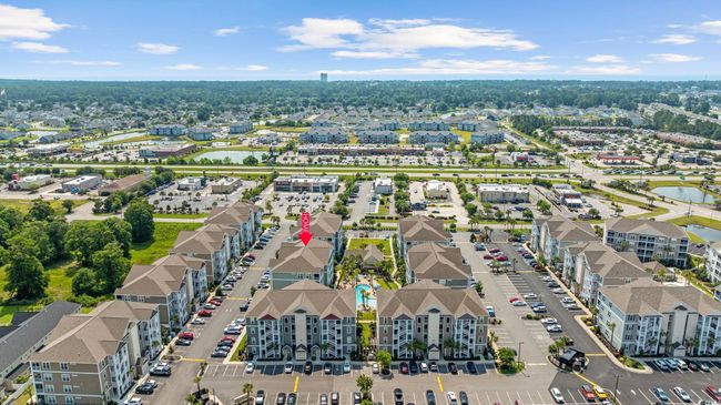 Aerial view of property and surrounding area featuring nearby suburban area and a large body of water | Image 36