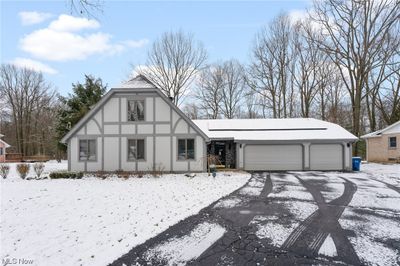 View of front facade featuring a garage | Image 1