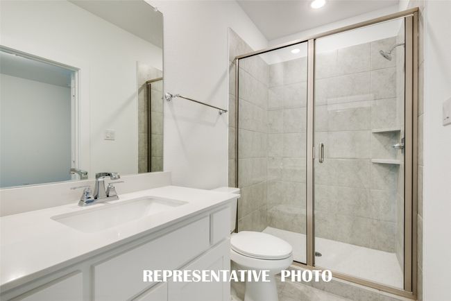 Guests will love the beautiful secondary baths in this fantastic home. REPRESENTATIVE PHOTO. | Image 17