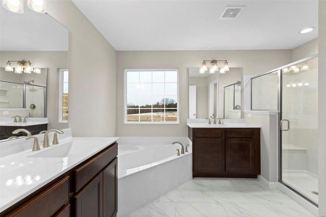 Bathroom featuring vanity and plus walk in shower | Image 6