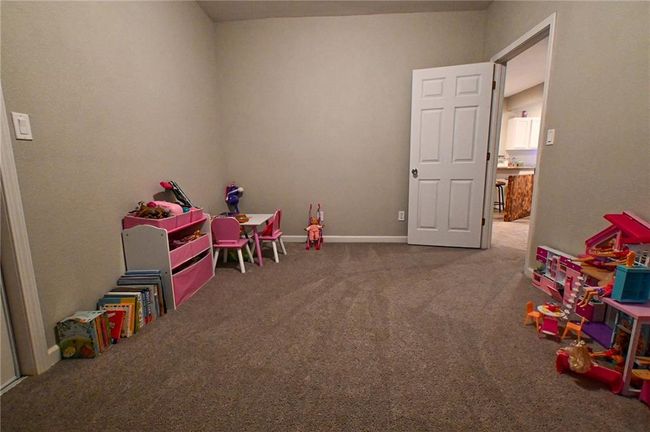 Recreation room with carpet flooring and baseboards | Image 27