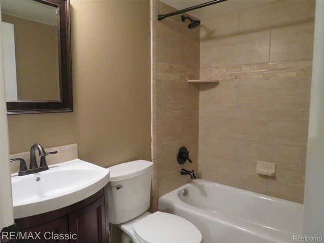 Remodeled full bathroom in the lower level. | Image 23