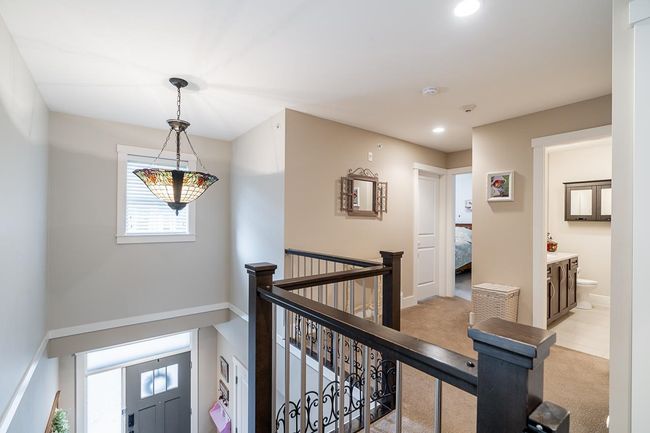 Corridor with light carpet, an upstairs landing, and recessed lighting | Image 16