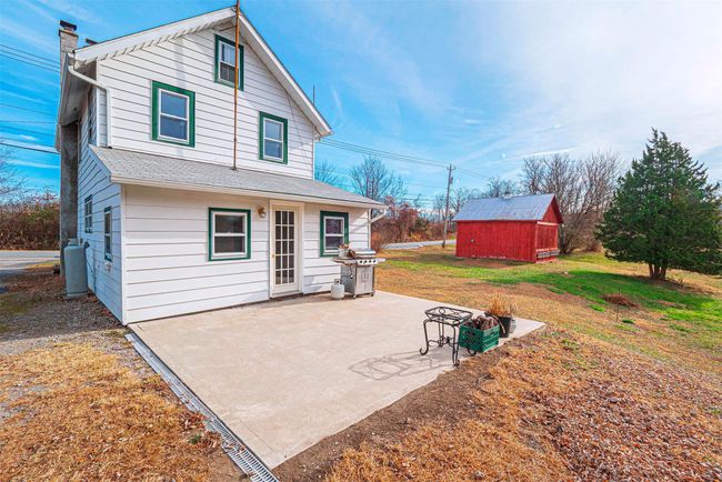 Back of house featuring a lawn, a patio, and a shed | Image 4