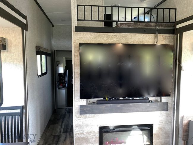 Flat screen TV over fireplace | Image 16