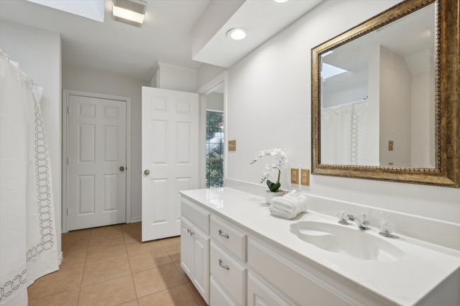 Full bathroom with double vanity and tile patterned flooring | Image 26