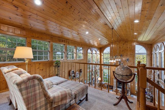 Sitting area of the owners bedroom overlooks the main living space. | Image 20