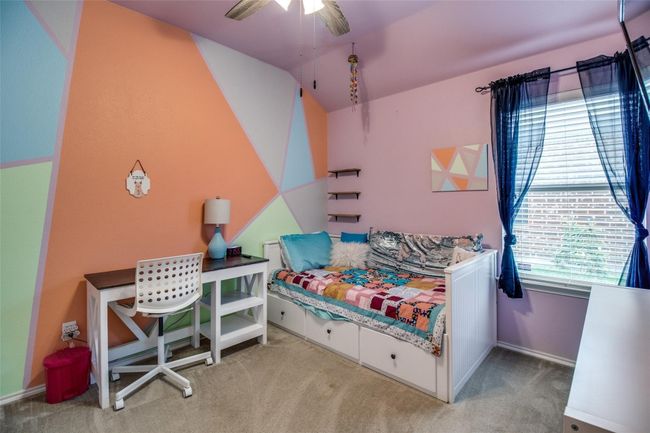 Bedroom with carpet floors, vaulted ceiling, and baseboards | Image 18