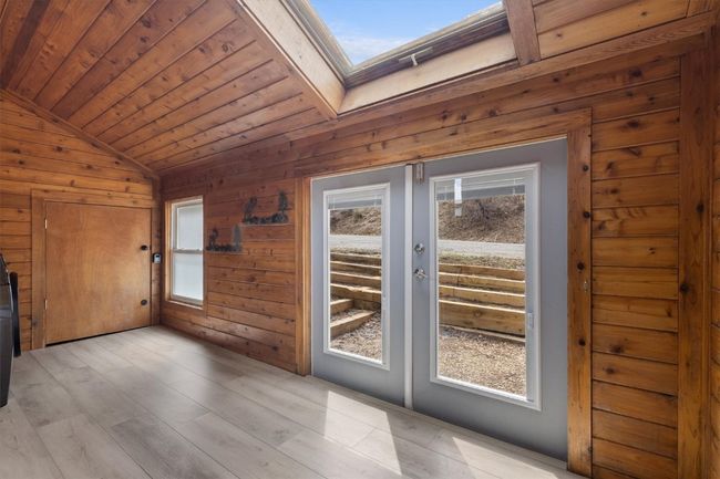 Sunroom with new luxury vinyl plank flooring | Image 25