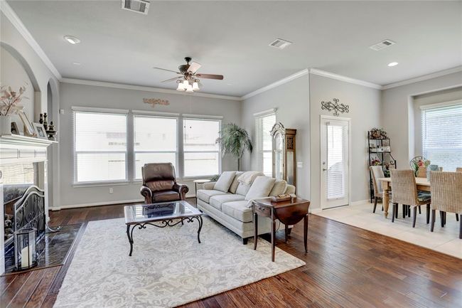 The living area provides ample space for comfortable seating alongside the breakfast area. | Image 13