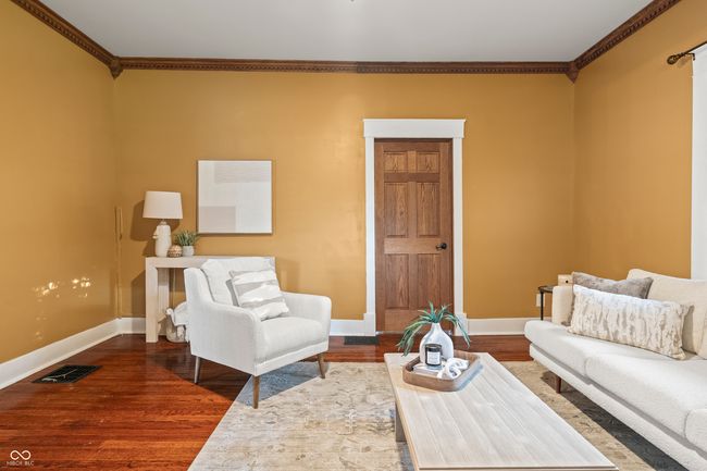 living room with ornamental molding and wood finished floors | Image 9