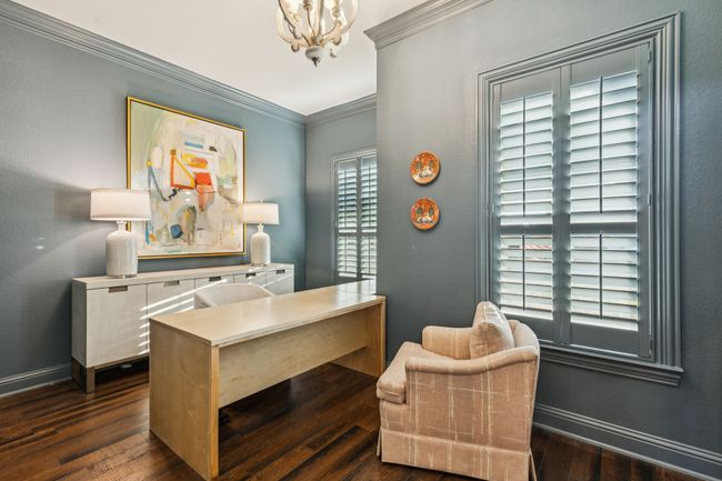 "Color washed" office with rustic light fixtue, built ins and venetian shutters | Image 9