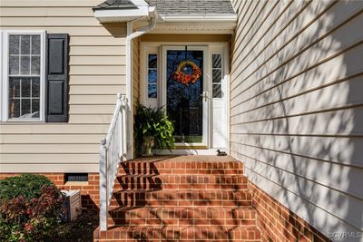 Welcoming brick stairs and covered entrance. | Image 2