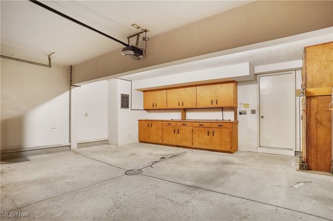 Garage with a garage door opener | Image 40