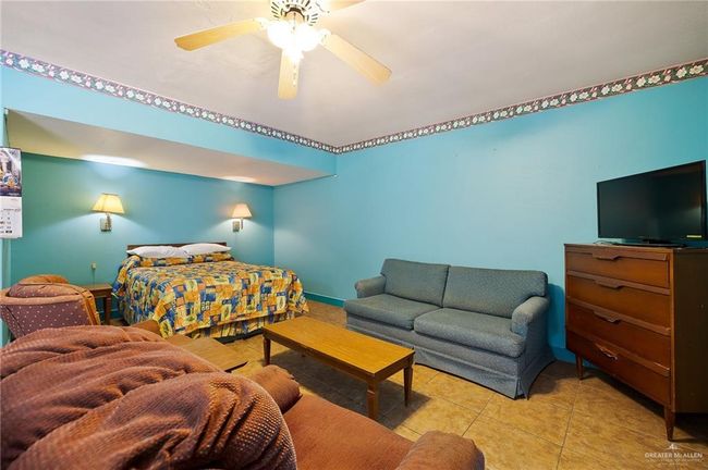 Tiled bedroom featuring baseboards and ceiling fan | Image 16