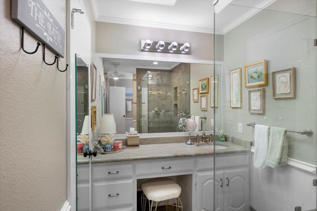 Full bathroom with ornamental molding, a shower stall, ceiling fan, and vanity | Image 22