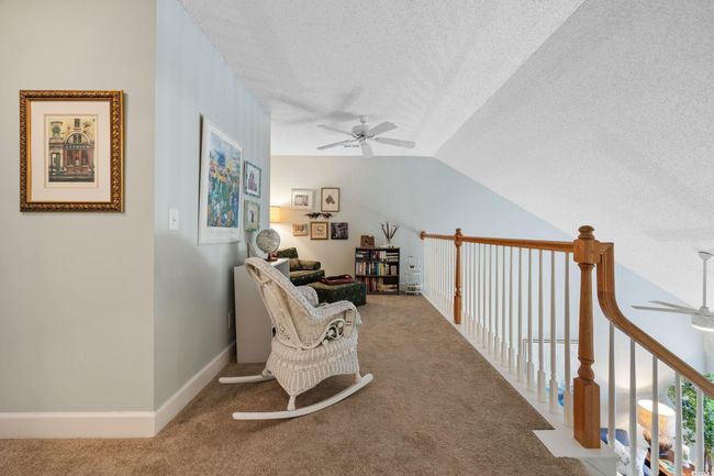 Living area with a ceiling fan, carpet floors, a textured ceiling, and vaulted ceiling | Image 27