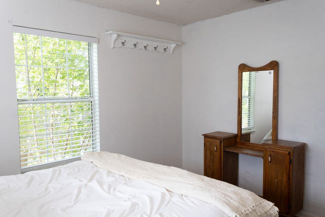 Bedroom featuring multiple windows and a textured ceiling | Image 25