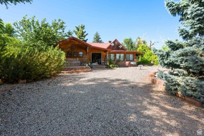 Back of property featuring covered porch | Image 3