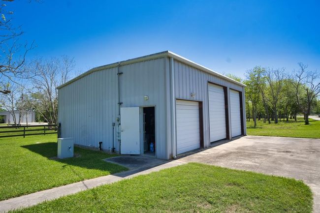 36 x 36 Shop. Smaller door goes into an enclosed workshop area. | Image 35