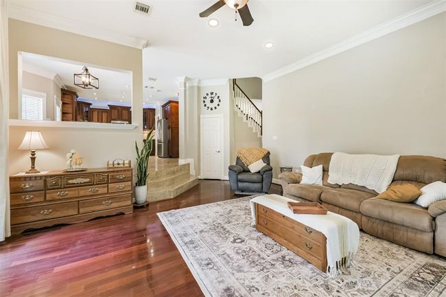 This kitchen seamlessly flows into the living room, perfect for effortless entertaining. | Image 6