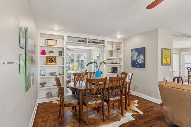 Spacious dining area, hardwood floors, and stylish built in shelving adds characters and richness. | Image 28