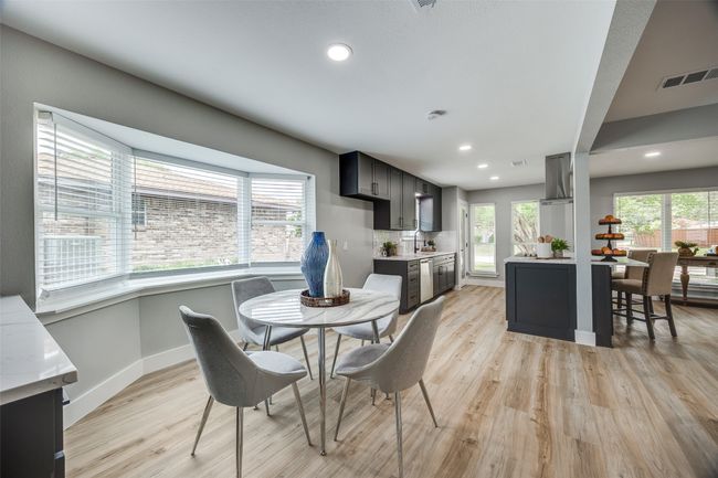 Dining area with light wood-style flooring and recessed lighting | Image 18