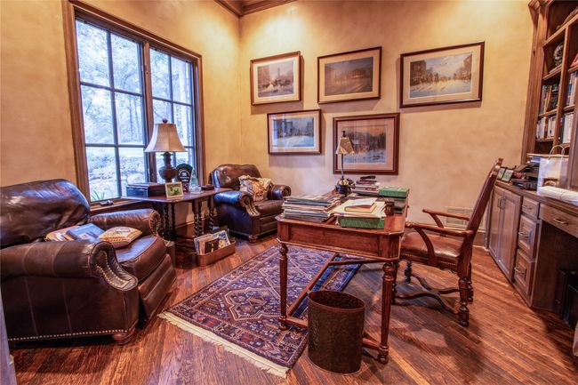 Office space with wood finished floors and a healthy amount of sunlight | Image 10